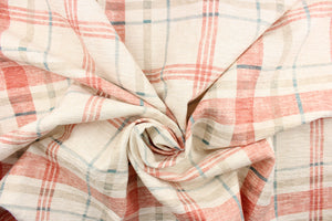 This velvet chenille fabric features a plaid design in coral pink, blue, cream, and a grayish khaki