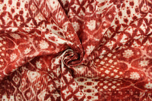 Load image into Gallery viewer, This fabric features a batik design in a garnet red and off white.
