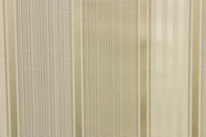  Light weight and formal best portray this yarn dye fabric. Offering  varying  width striped pattern in a gold, light green, gray, and light beige color along with a slight sheen to enhance the various colors.