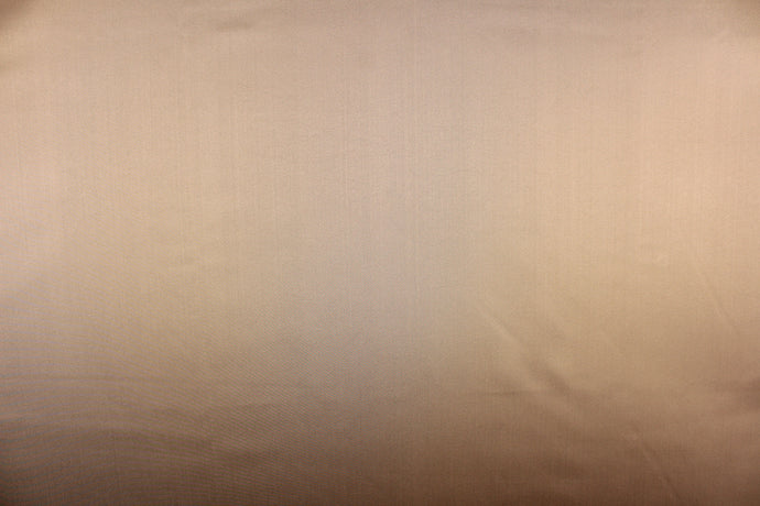  A beautiful satin fabric in a rich tan color. 