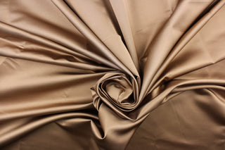  A beautiful satin fabric in a rich tan color. 