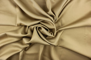 This beautiful versatile fabric offers a slight sheen in a solid beige. 