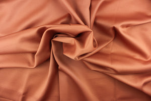 This beautiful versatile fabric offers a slight sheen in a solid dark clay.