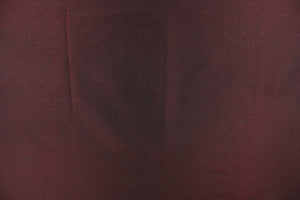 This beautiful jacquard fabric features an embroider pin head design in a deep dark burgundy. 