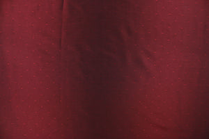 This beautiful jacquard fabric features an embroider pin head design in a rich red. 
