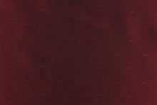 Load image into Gallery viewer, This beautiful jacquard fabric features an embroider pin head design in a rich red. 
