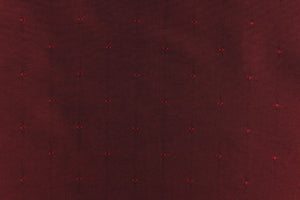 This beautiful jacquard fabric features an embroider pin head design in a rich red. 