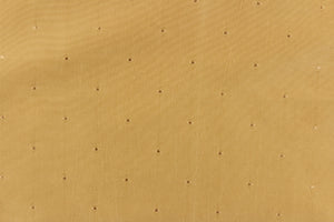 This beautiful jacquard fabric features an embroider pin head design in a golden tan.