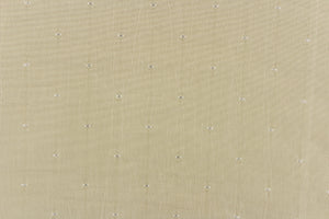  This beautiful jacquard fabric features an embroider pin head design in a pale gray beige.