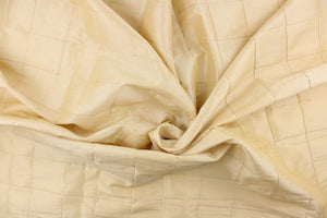  This beautiful jacquard fabric features an pin tuck block design in a light khaki color.