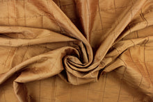 Load image into Gallery viewer, This beautiful jacquard fabric features an pin tuck block design in a rich golden tan color.
