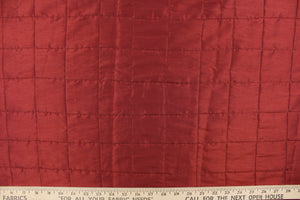 This beautiful jacquard fabric features an pin tuck block design in a rich red color. 