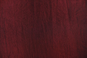 This taffeta fabric features a crinkle in iridescent deep red.