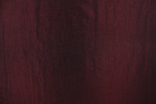 Load image into Gallery viewer, This taffeta fabric features a crinkle in iridescent dark burgundy. 
