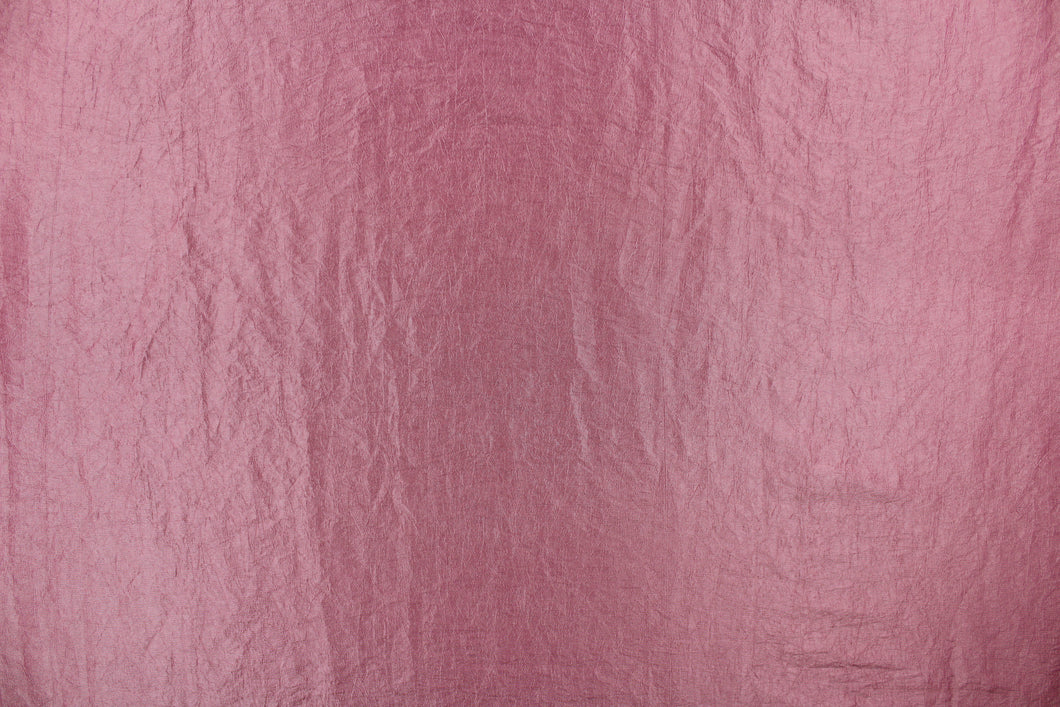 This taffeta fabric features a crinkle design in a beautiful mauve. 