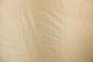  This taffeta fabric features a crinkle design in light gold.