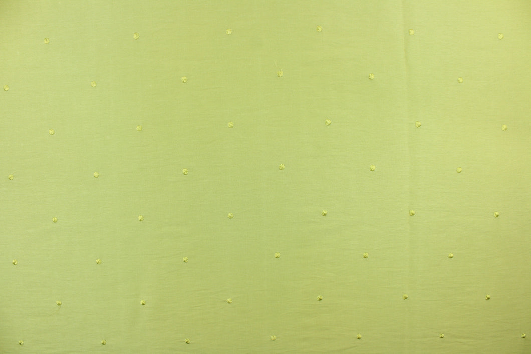 This beautiful jacquard fabric features an embroider nail head design in a rich lime green color.