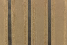 Load image into Gallery viewer, This stunning yarn dyed fabric features a striped pattern in gold tones and gray. 
