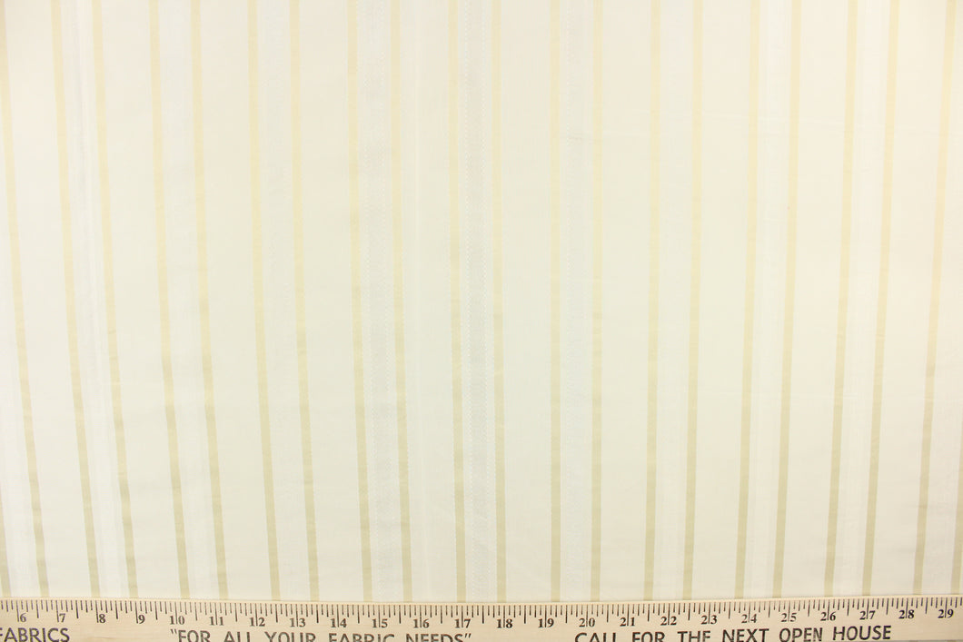 This stunning yarn dyed fabric features a striped pattern in ivory, white and cream