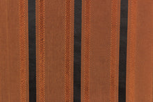 Load image into Gallery viewer, This stunning yarn dyed fabric features a striped pattern in bronze orange and black.
