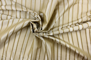 This stunning yarn dyed fabric features a striped pattern in beige and taupe