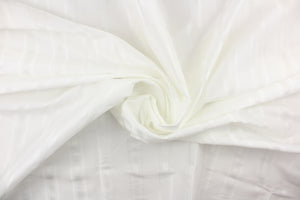 This stunning yarn dyed fabric features a striped pattern in bright white. 