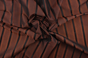  This stunning yarn dyed fabric features a striped pattern in a rich brown and black. 