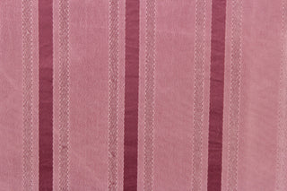 This stunning yarn dyed fabric features a striped pattern in rose pink. 