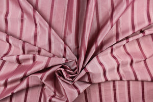 This stunning yarn dyed fabric features a striped pattern in rose pink. 