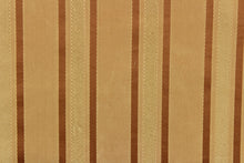 Load image into Gallery viewer,  This stunning yarn dyed fabric features a striped pattern in rich gold tones.
