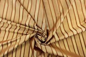  This stunning yarn dyed fabric features a striped pattern in rich gold tones.