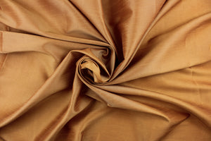 A mock linen fabric in a rich solid golden tan