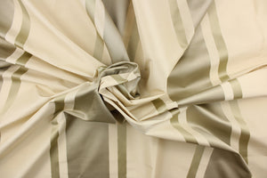  This stunning yarn dyed fabric features a striped pattern in cream or light khaki and silver.