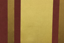 Load image into Gallery viewer, This stunning yarn dyed fabric features a  striped pattern in plum and gold tones.
