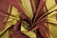 Load image into Gallery viewer, This stunning yarn dyed fabric features a  striped pattern in plum and gold tones.
