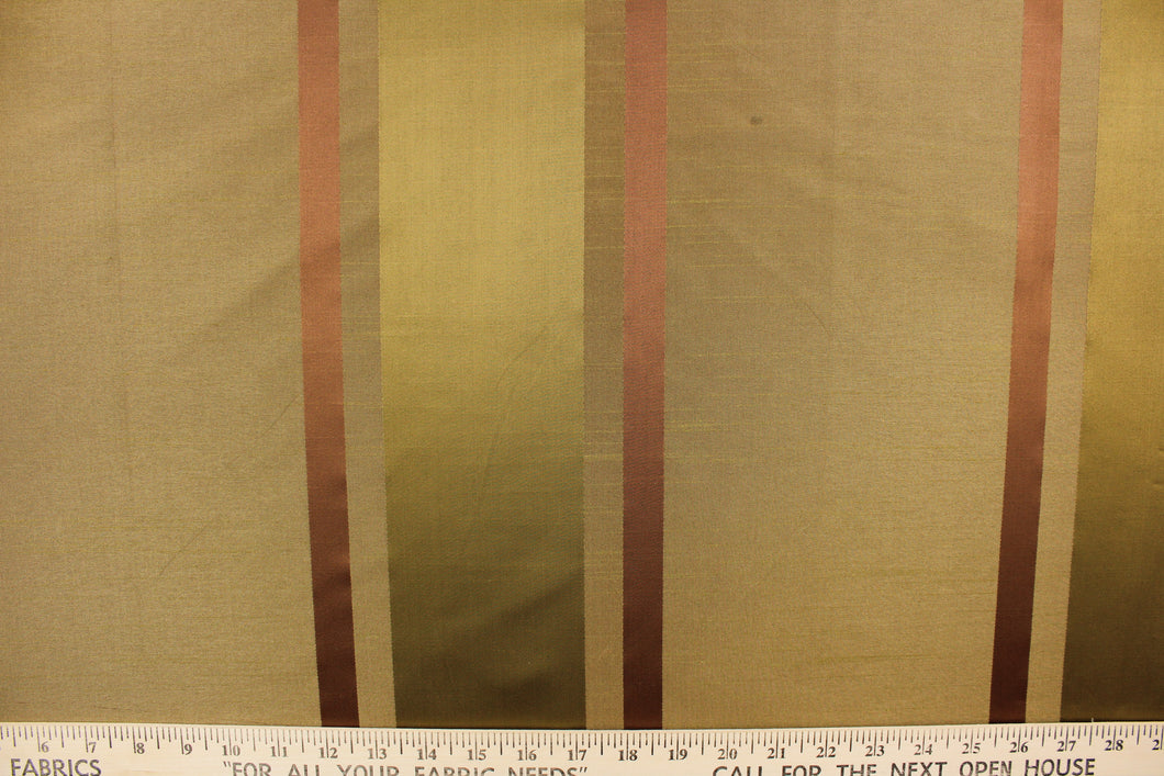 This stunning yarn dyed fabric features a striped pattern in dark copper and dark gold tones. 