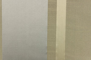 This stunning yarn dyed fabric features a striped pattern in gold, silver and khaki. 