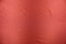 Load image into Gallery viewer, This taffeta fabric in a solid brick red. 
