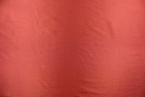 This taffeta fabric in a solid brick red. 