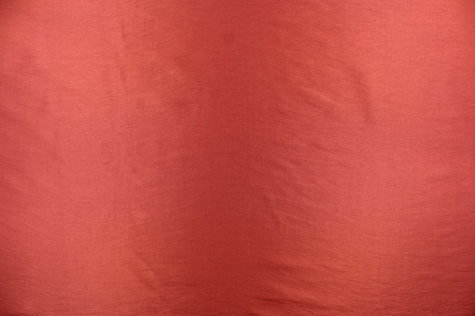 This taffeta fabric in a solid brick red. 