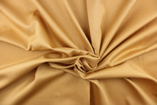 Load image into Gallery viewer, This beautiful versatile fabric offers a slight sheen in a solid manilla gold. 
