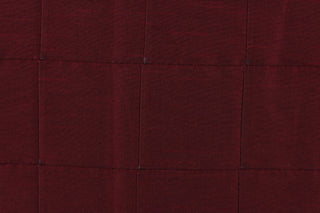 This beautiful jacquard fabric features an pin tuck block design in a  deep wine color. 