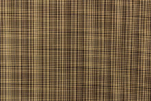 Load image into Gallery viewer, This stunning yarn dyed fabric features a small plaid design in shades of brown with hints of gray. 
