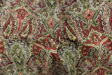 Load image into Gallery viewer, This paisley print design has a distressed look and would be perfect for  window treatments (draperies, valances, curtains and swags), toss pillows, duvet covers, and upholstery projects.  It is soil and stain repellant and has a soft workable feel yet is stable and durable with 27,000 double rubs.  Colors included are red, green, brown and blue.
