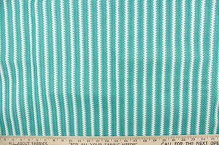 This green and white striped fabric is perfect for outdoor settings and indoors in sunny rooms. 