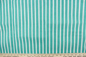 This green and white striped fabric is perfect for outdoor settings and indoors in sunny rooms. 