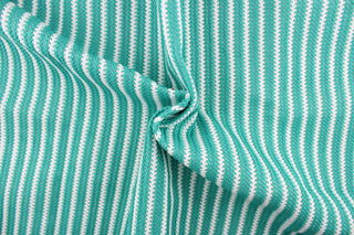 This green and white striped fabric is perfect for outdoor settings and indoors in sunny rooms. 