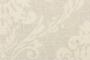  This jacquard fabric features a woven ornamental damask medallion in natural. 