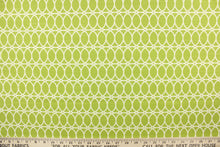 Load image into Gallery viewer, This contemporary design features interlocking white circles set against a lime green background. 
