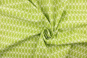 This contemporary design features interlocking white circles set against a lime green background. 